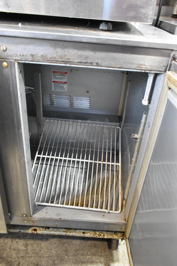 Beverage Air UCR36A stainless steel undercounter cooler with 2 doors, commercial casters, visible wear, and power details.