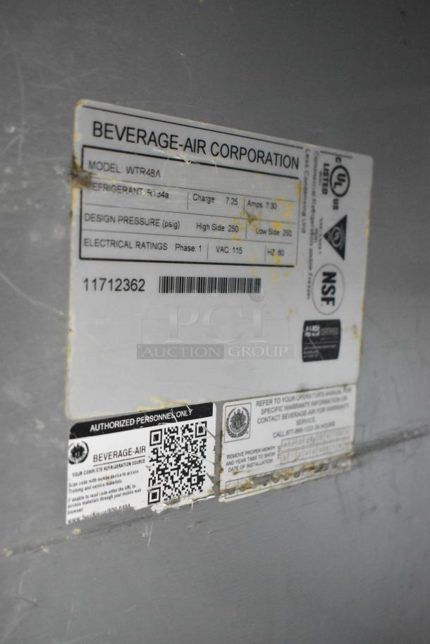 Beverage Air WTR48A label showing model info, refrigerant type, design pressure, and electrical ratings. Stainless steel cooler.