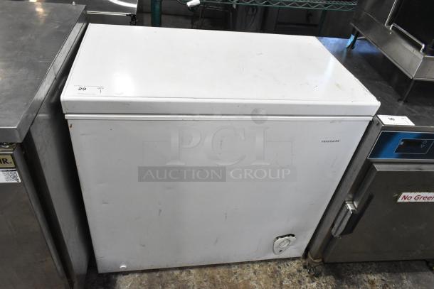 Frigidaire FFFC07M2UW metal chest freezer with hinge lid, 115 volts, slight wear and scratches, auction label 29 visible.