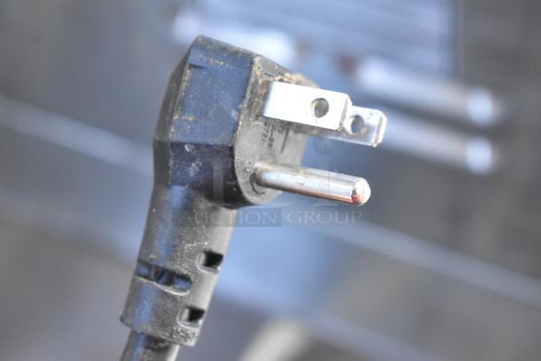 Close-up of plug for 2019 Alto Shaam 750-S undercounter heated holding cabinet, 115V, 1 phase. Slight wear visible.