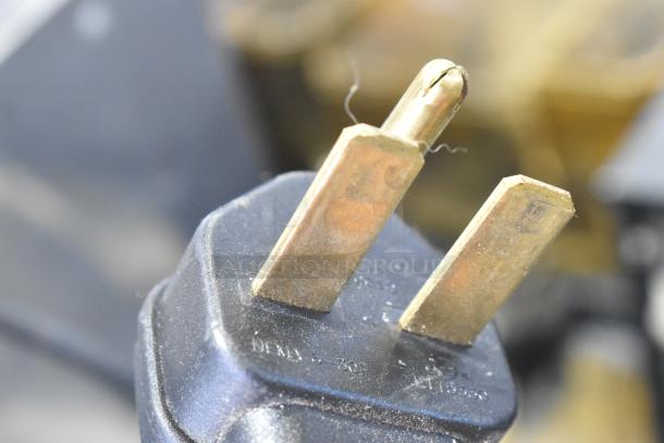 Close-up of a NEMA 6-20P plug, suitable for a Merrychef eikon e2S rapid cook oven, 208/240 volts, 1 phase.