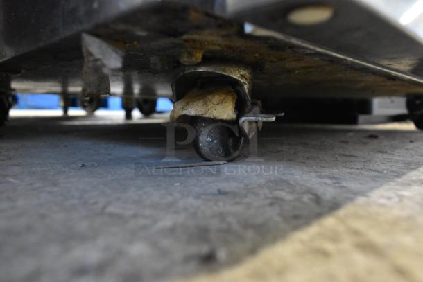 2019 Delfield 406P-STAR2 stainless steel undercounter cooler with visible worn commercial caster, 115 volts, 1 phase.