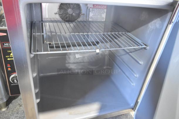 2019 Delfield 406P-STAR2 stainless steel undercounter cooler with single door, wire shelf, and commercial casters. 115V, 1 Phase.