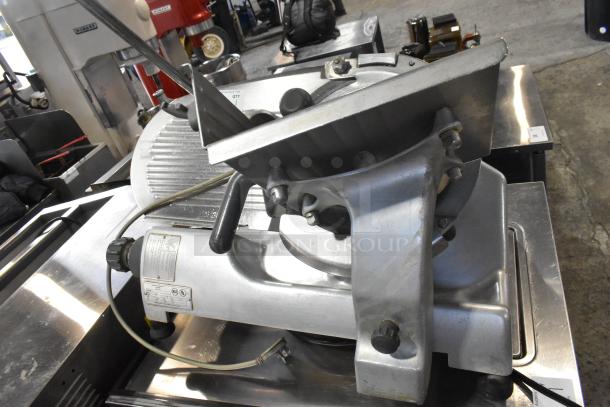 Hobart 2612 stainless steel countertop meat slicer with blade sharpener. Features 115 volts, 1 phase, and visible model label.