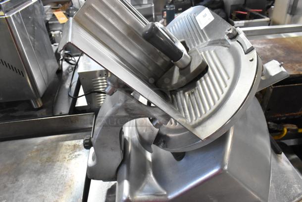Hobart 2612 stainless steel commercial meat slicer with blade sharpener; 115 volts, 1 phase. Appears in good condition.