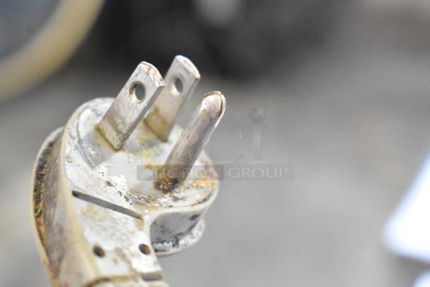Rusted power plug from a Hobart 2612 commercial countertop meat slicer, showing visible oxidation and damage.
