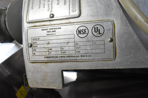 Hobart 2612 stainless steel meat slicer, countertop model, features built-in blade sharpener. NSF and UL listed, 115 volts.