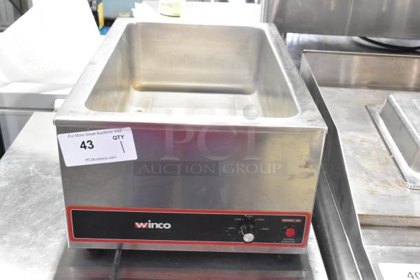 Winco FW-S500 stainless steel commercial countertop food warmer, 120 volts, 1 phase, with visible control panel and auction label.