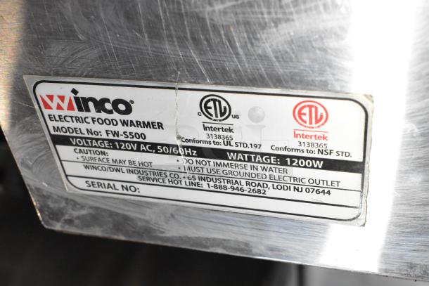 Winco FW-S500 stainless steel countertop food warmer, 120V, 1 phase, label shows voltage and safety warnings.
