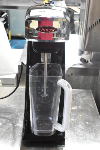 Omega M1000 metal countertop drink mixer, single head, 120 volts, 1 phase, with Omega logo and measurement markings.
