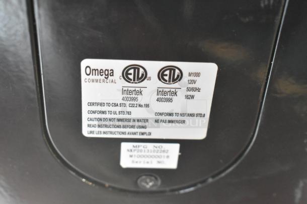 Omega M1000 metal countertop single head drink mixer, 120V, 1 phase. Label indicates certifications and model details.