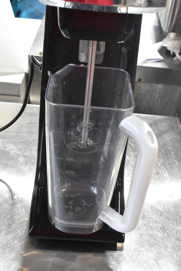 Omega M1000 metal countertop single head drink mixer, 120V, 1 phase, includes clear plastic mixing container with measurements.