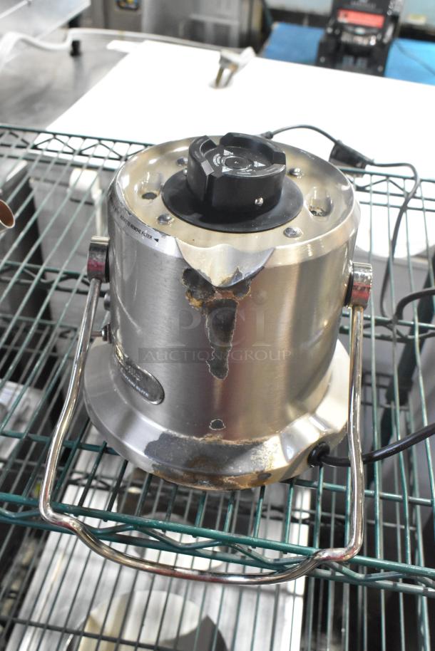 Breville stainless steel commercial countertop juicer, 115 volts, 1 phase. Visible wear, scratches, and rust on surface.