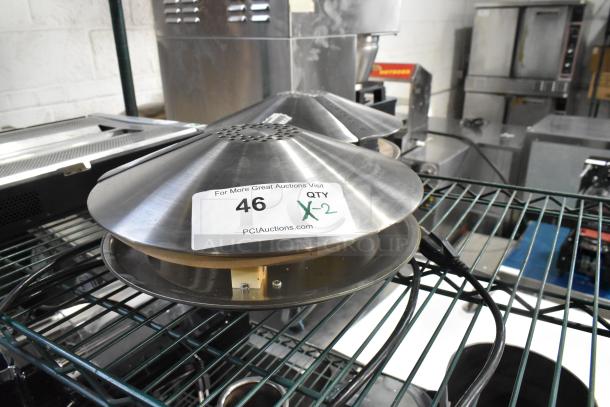 2 Synergetic Metal Bug Zappers, silver finish, on a shelf. Tag shows quantity X2. In good condition.