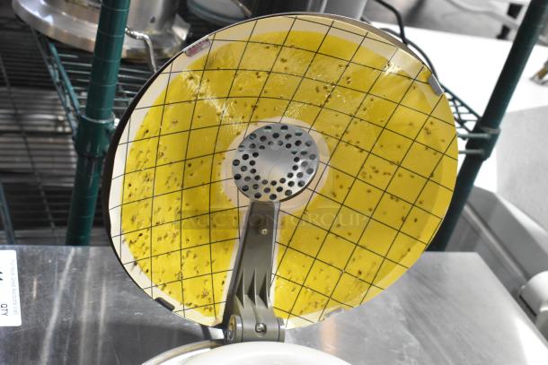 Two Synergetic metal bug zappers, grid design, visible insects attracted to sticky surface, excellent condition.