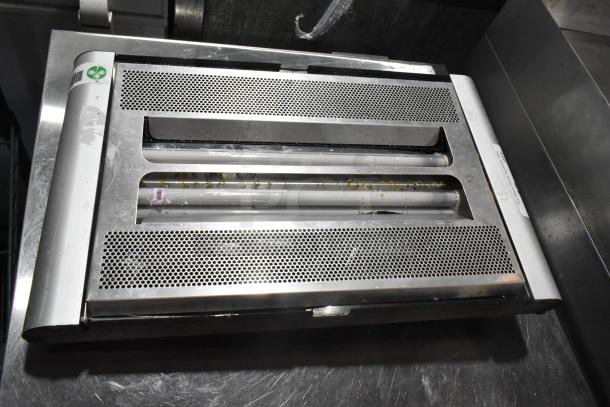 Metal bug zapper, 115 volts, 1 phase, perforated metal design, minor wear, visible label, effective pest control device.