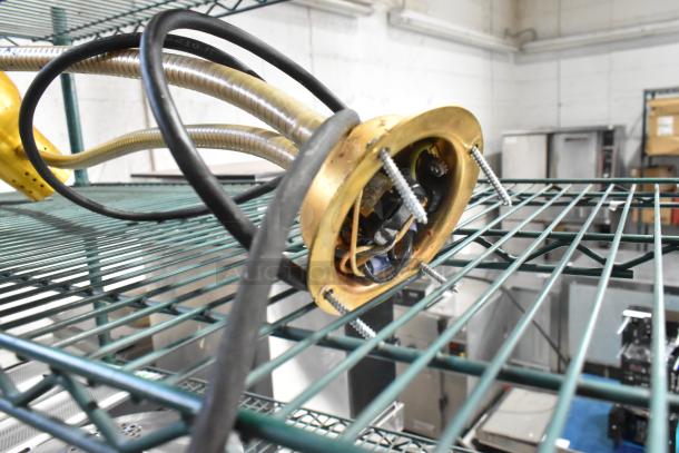 Metal 2-head food warming lamp with exposed wiring and metal support. Used condition, suitable for kitchen or catering use.