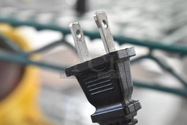 Close-up of a two-prong plug for the Ninja BL610 Metal Countertop Blender, 120 Volts, 1 Phase.