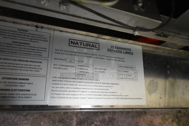 Label on the Cookline CR36-6 stainless steel commercial range highlighting BTU consumption, pressure, and clearance requirements.