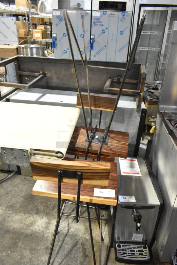 Three bar height chairs with wooden seats and metal legs. Excellent condition, item tag shows quantity of three.