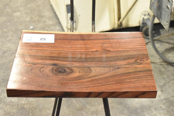 Wooden and metal bar height chair seat close-up, wood grain visible, labeled "Qty 3, 52".