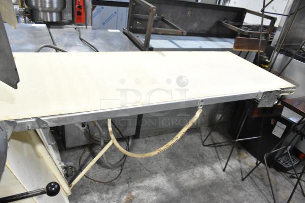 Seewer Rondo S metal commercial dough sheeter, reversible floor style. Features include a sturdy metal build and versatile functionality.