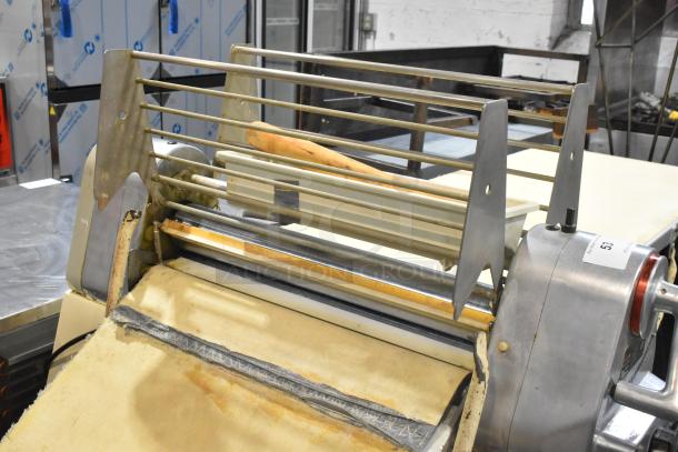 Seewer Rondo S metal commercial reversible dough sheeter in good condition, with visible controls and safety grilles.