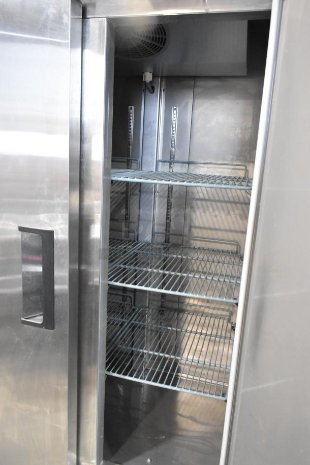 Coldline C35R stainless steel 2-door reach-in cooler with poly-coated racks, commercial casters, 115V, 1 phase.