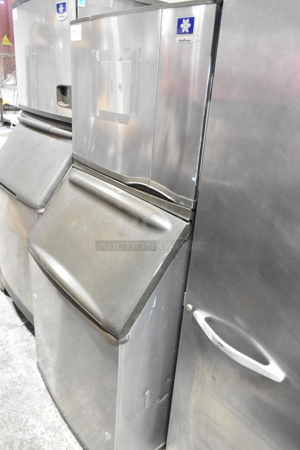 Manitowoc SY0504A stainless steel ice head on B570 bin, 115 volts, 1 phase. Good condition, visible branding.
