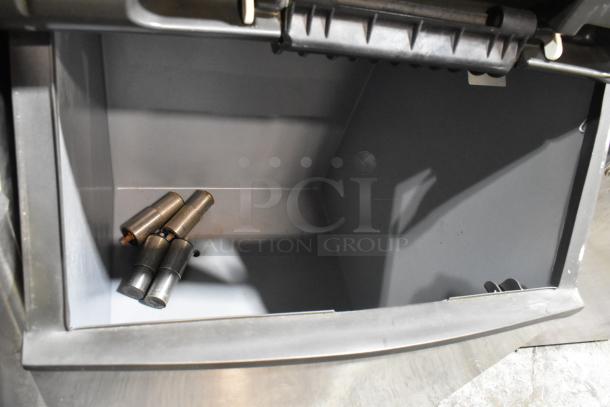 Manitowoc SY0504A stainless steel ice head on B570 bin. 115V, 1 phase. Commercial use. Clean interior view.