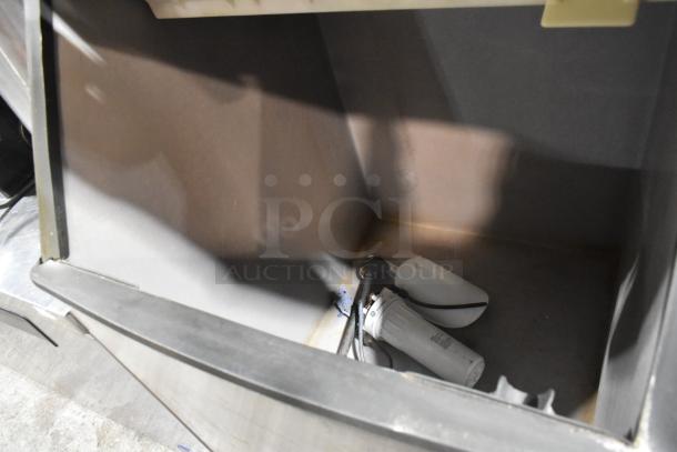 Manitowoc ID0606W-261 ice head on S570 bin, stainless steel, 208-230V, 1 phase, inside view showing components.