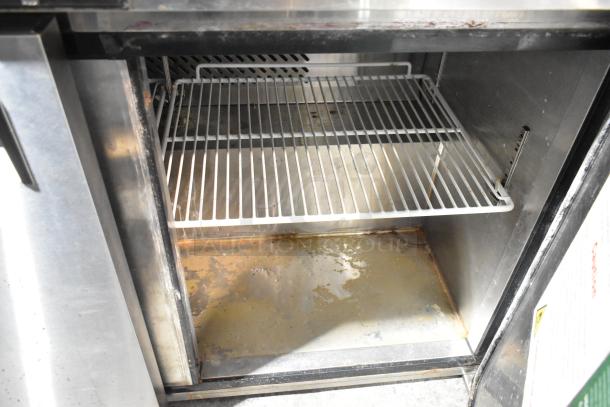 2021 Atosa MHG8406GR 2-door undercounter freezer, 115V, stainless steel, shows interior shelves, some wear visible.