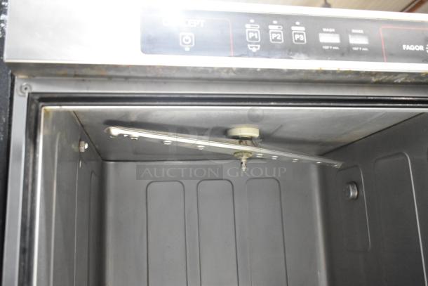 Fagor CO-502W undercounter dishwasher interior view. Stainless steel, 208-240V, 1 phase. Control panel visible.