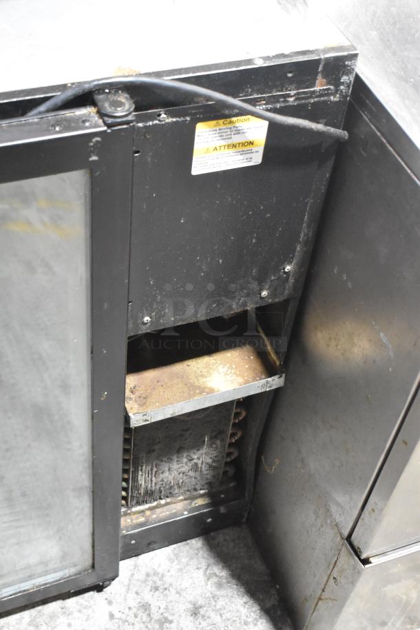 Beverage Air BB48GY-1-B commercial 2-door back bar cooler, metal exterior, visible wear, 115V, caution label displayed.