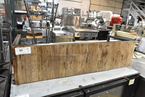 Wooden over shelf with rustic finish, showing natural grain patterns. Auction label indicates item number 65, quantity 1.