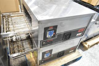 Two 2021 Middleby Marshall CTX DZ33I stainless steel conveyor pizza ovens on casters, 208V, in good condition.