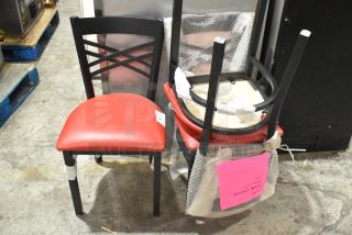 3 black metal dining-height chairs with red seat cushions, in good condition, stacked for display. Pink tag reads "TS SIDE CHAIR MODEL 9252".