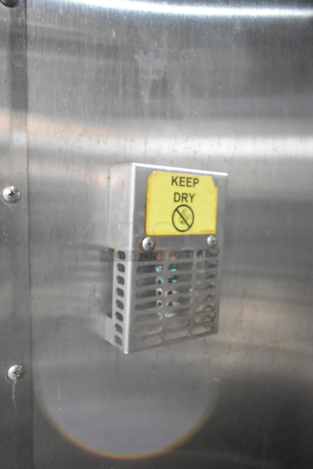 Baxter Stainless Steel Commercial Electric Roll In Rack Proofer with "Keep Dry" warning label displayed, in used condition.