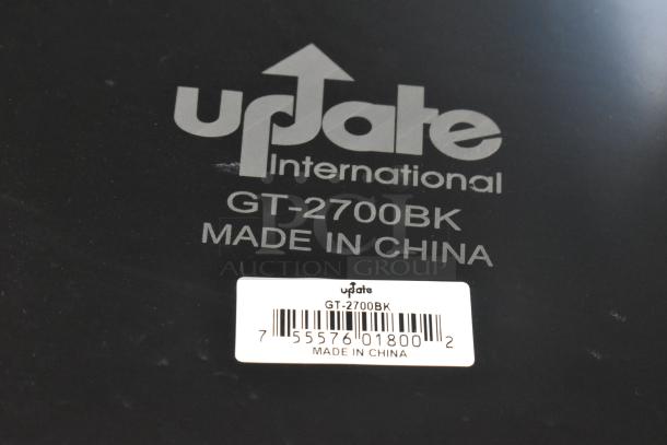 7 Update International GT-2700BK black food trays, made in China, with label and barcode visible.