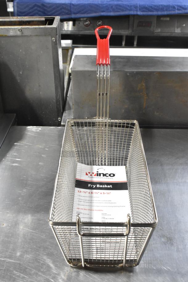 Brand new metal fry basket, Winco FB-25 model, scratch and dent condition, red plastic handle, dimensions 12-3/4" x 6-1/2" x 5-1/4".