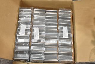 Box of brand new Tablecraft hot dog prep trays, sealed in plastic. Trays are stacked neatly in cardboard box, with labels visible.