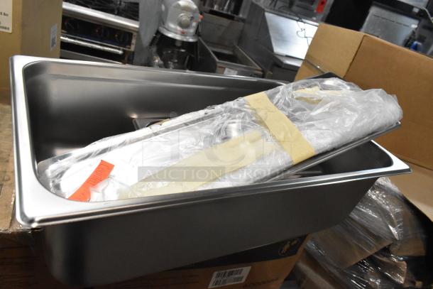 Brand new kitchen items including metal mesh pizza screens, metal bowl, stainless steel pans and lids, packaged together.