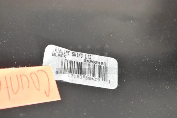 Four brand new black Slim Jim trash can swing lids, item code 34202403, with barcode label visible.