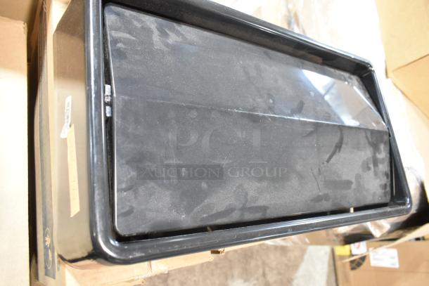 Brand new Poly Swinging Slim Jim trash can lid, black, rectangular design. Four pieces available.