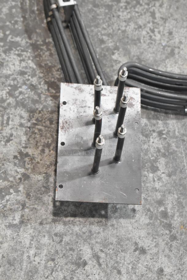 Four brand new metal burners with connectors, mounted on a metal plate, perfect condition, enhance bid value.