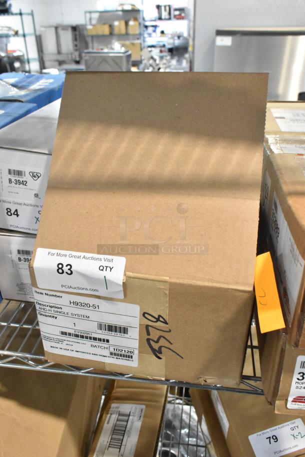 Brand new H9320-51 water filtration system in sealed cardboard box with visible item and batch labels.
