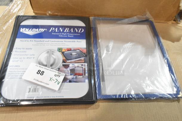 7 new Vollrath pan bands, sealed, high-temp silicone, fits steamable pans, dishwasher safe, easy to apply, auction label visible.