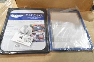 7 new Vollrath pan bands, sealed, high-temp silicone, fits steamable pans, dishwasher safe, easy to apply, auction label visible.