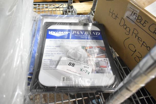 7 brand new Vollrath Pan Band lids, dishwasher safe, reusable, heat-resistant to 450°F, in original packaging.