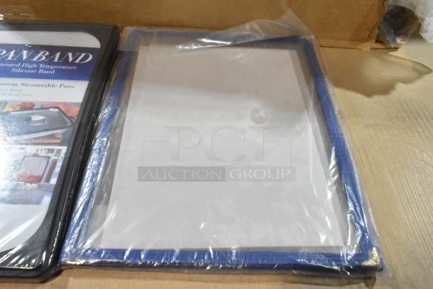 Seven brand new Vollrath Pan Band lids in packaging. Includes high temperature silicone bands.